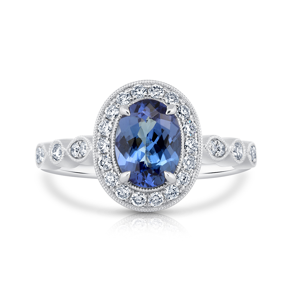 View Oval Tanzanite And Fancy Diamond Halo Ring